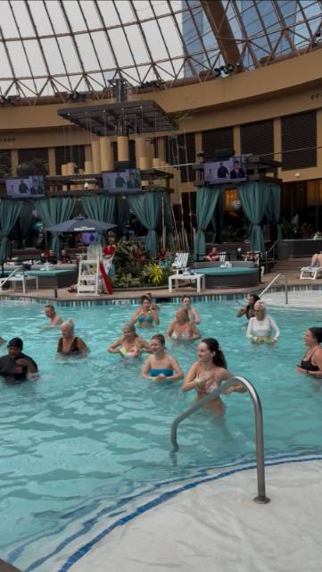 Aqua fitness class in the pool under the glass dome at Harrah's