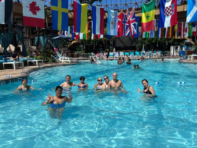 Class guests together in the sunlit pool at Harrah's